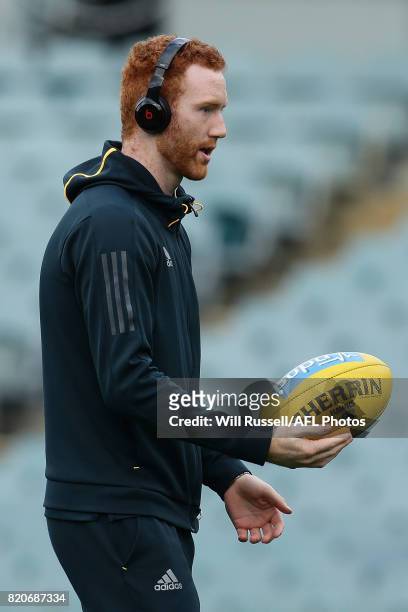 Conor Glass of the Hawks warms up on the field before the round 18 AFL match between the Fremantle Dockers and the Hawthorn Hawks at Domain Stadium...
