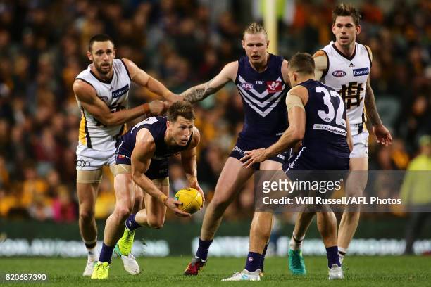 Lee Spurr of the Dockers controls the ball during the round 18 AFL match between the Fremantle Dockers and the Hawthorn Hawks at Domain Stadium on...