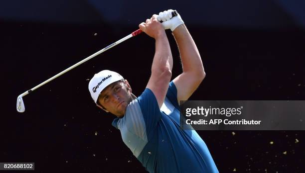 Spain's Jon Rahm watches his iron shot from the 10th tee during his third round on day three of the Open Golf Championship at Royal Birkdale golf...