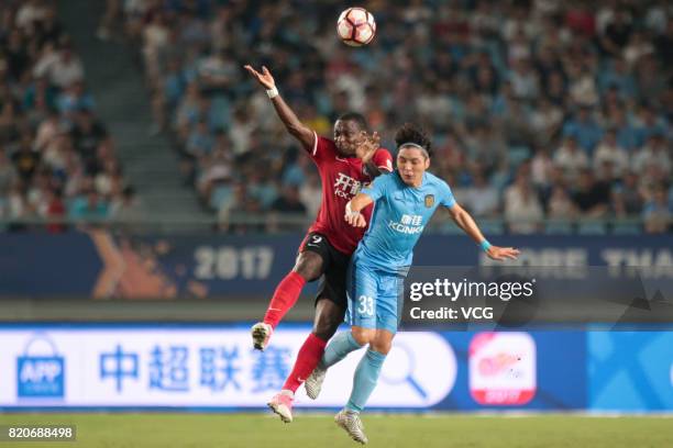 Anthony Ujah of Liaoning Whowin and Wang Song of Jiangsu Suning reacts during the 18th round match of 2017 Chinese Football Association Super League...