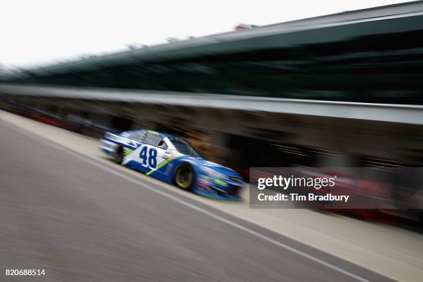 Jimmie Johnson, driver of the Lowe's Chevrolet, drives through the garage area during practice for the Monster Energy NASCAR Cup Series Brickyard 400...