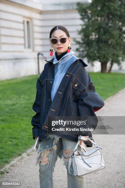 Fashion buyer for Restir Maiko Shibata wears a Loewe bag, Facetasm jacket, R13 jeans, Balenciaga shirt on day 3 during Paris Fashion Week...