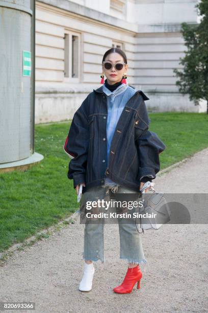 Fashion buyer for Restir Maiko Shibata wears a Loewe bag, Celine shoes, Facetasm jacket, R13 jeans, Balenciaga shirt on day 3 during Paris Fashion...