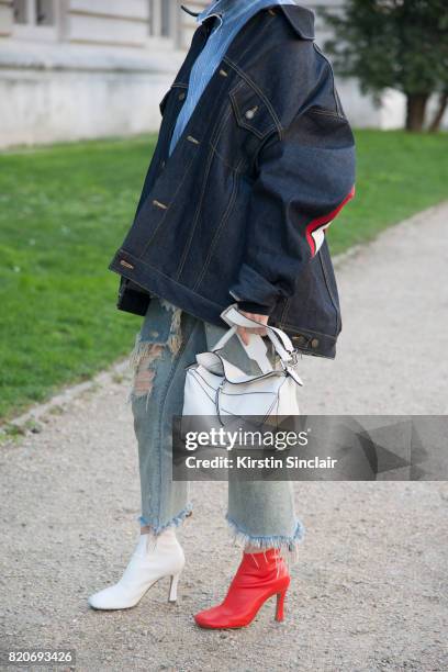 Fashion buyer for Restir Maiko Shibata wears a Loewe bag, Celine shoes, Facetasm jacket, R13 jeans, Balenciaga shirt on day 3 during Paris Fashion...
