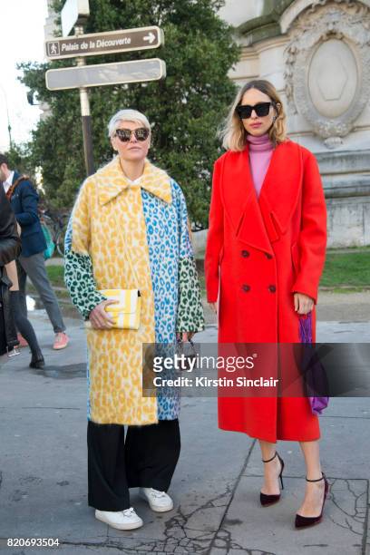 Fashion Stylist Elisa Nalin wears an Acne coat with Fashion blogger Candela Novembre wears a Stella McCartney coat, Celine sunglasses, Jimmy Choo...