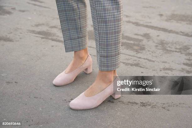 Editor in chief of l"u2019OFFICIEL Ukraine, Ulyana Boyko wears Sandro trousers and Cos shoes on day 3 during Paris Fashion Week Autumn/Winter 2017/18...