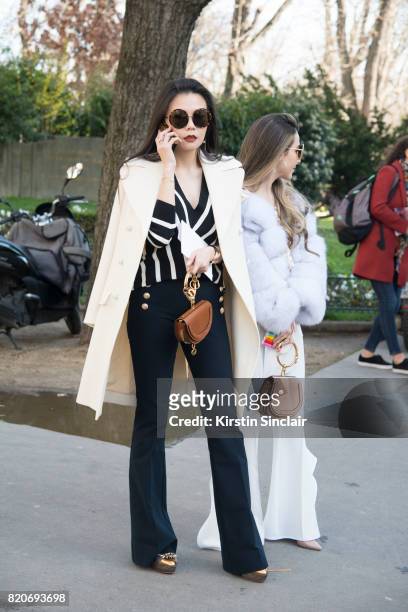 Rita Hsieh wears a Chloe top, jacket and bag, Linda farrow sunglasses and Derek Lam trousers on day 3 during Paris Fashion Week Autumn/Winter 2017/18...