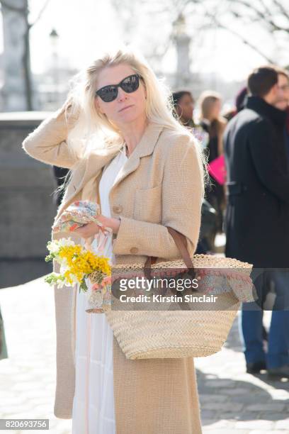 Fashion and accessories designer for Little Miss Ella Sarah Gray wears a vintage dress, Little Miss Ella bag on day 3 during Paris Fashion Week...