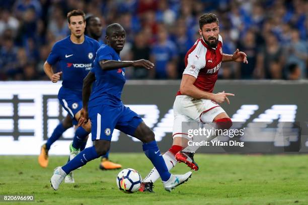 Olivier Giroud of Arsenal passes against N'Golo Kant of Chelsea during the Pre-Season Friendly match between Arsenal FC and Chelsea FC at Birds Nest...