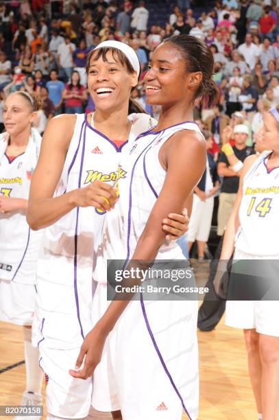 Tangela Smith and LaToya Pringle of the Phoenix Mercury celebrate a victory against the Seattle Storm on July 25 at U.S. Airways Center in Phoenix,...