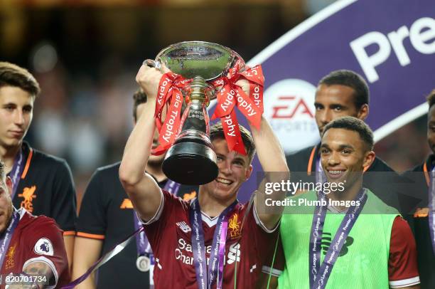 John Flanagan of Liverpool lifts the Premier League Asia Trophy after the Premier League Asia Trophy Final between Liverpool FC and Leicester City on...