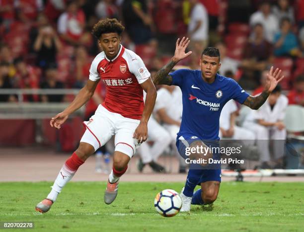 Reiss Nelson of Arsenal takes on Kennedy of Chelsea during the match between Arsenal and Chelsea at Birds Nest on July 22, 2017 in Beijing, China.