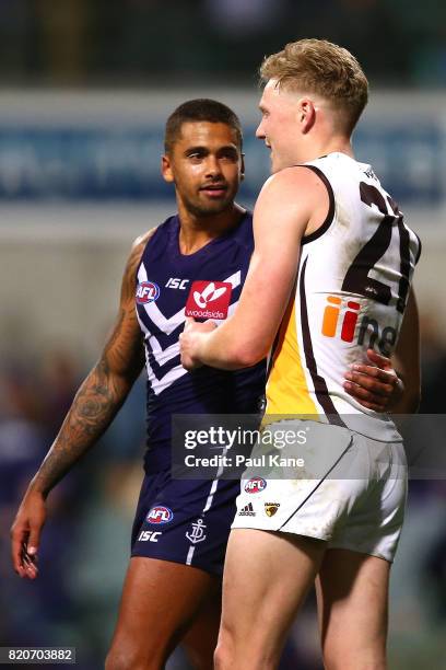 Bradley Hill of the Dockers shares a moment with James Sicily of the Hawks after the round 18 AFL match between the Fremantle Dockers and the...