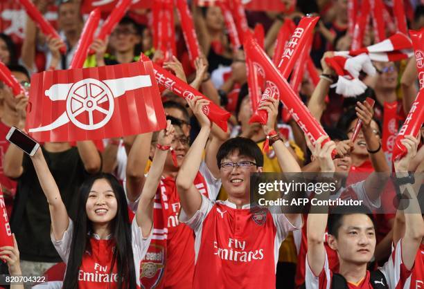 Arsenal fans chant before the start of the pre-season football match against Chelsea in Beijing's National Stadium on July 22, 2017. / AFP PHOTO /...