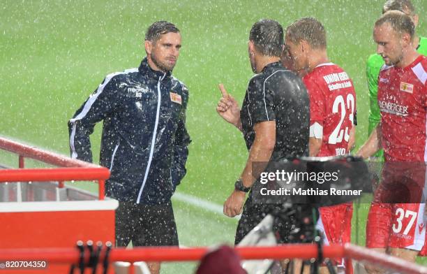 Assistant coach Sebastian Boenig of 1 FC Union Berlin and referee Henry Mueller during the game between Union Berlin and the Queens Park Rangers on...