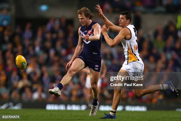 David Mundy of the Dockers passes the ball during the round 18 AFL match between the Fremantle Dockers and the Hawthorn Hawks at Domain Stadium on...