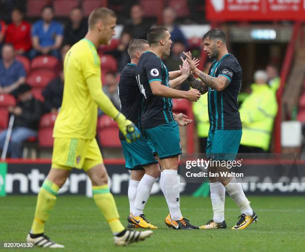 Charlie Austin of Southampton celebrates scoring a goal during the Pre Season Friendly match between Brentford and Southampton at Griffin Park on...