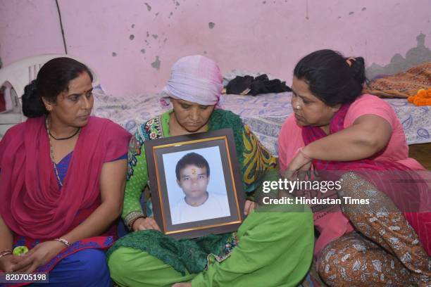 Family members of Mandeep Singh Negi mourn, who was allegedly cremated by Sahibabad Police on July 13, on July 22, 2017 in Ghaziabad, India. Mandeep...