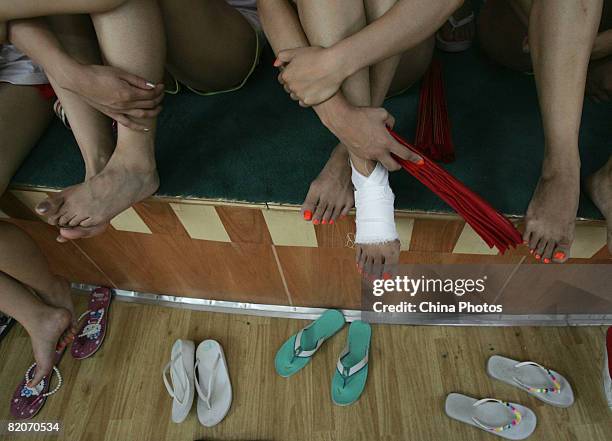 Members of a cheering squad prepare for a training on July 25, 2008 in Yanjiao of Hebei Province, China. A total of 27 cheering squads which will...