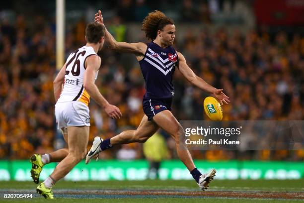 Griffin Logue of the Dockers passes the ball during the round 18 AFL match between the Fremantle Dockers and the Hawthorn Hawks at Domain Stadium on...