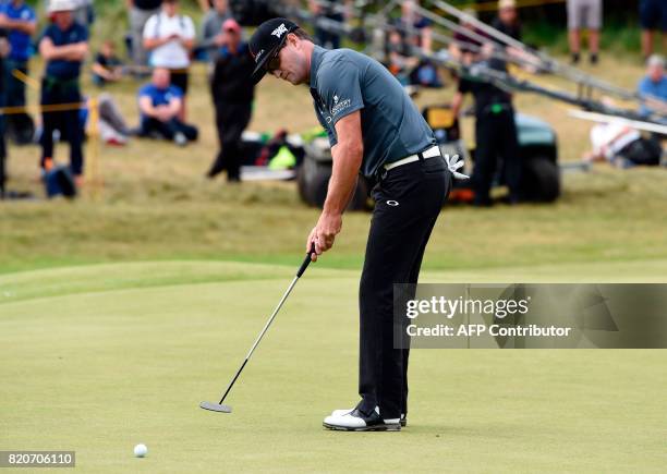Golfer Zach Johnson putts on the 7th green during his third round on day three of the Open Golf Championship at Royal Birkdale golf course near...