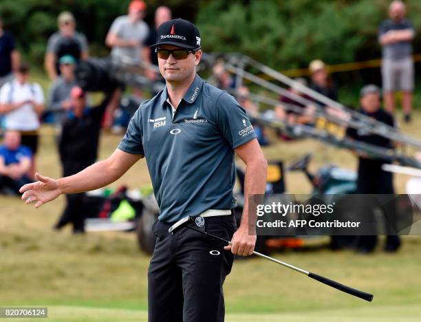 Golfer Zach Johnson reacts to his putt on the 7th green during his third round on day three of the Open Golf Championship at Royal Birkdale golf...