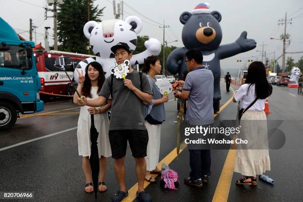 People visit PyeongChang Olympic booth during the ceremony marking the 200 days to go to the PyeongChang Winter Olympic Games on July 22, 2017 in...