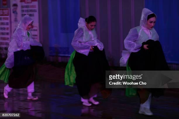 Korean traditional dancers walk to the stage during the ceremony marking the 200 days to go to the PyeongChang Winter Olympic Games on July 22, 2017...