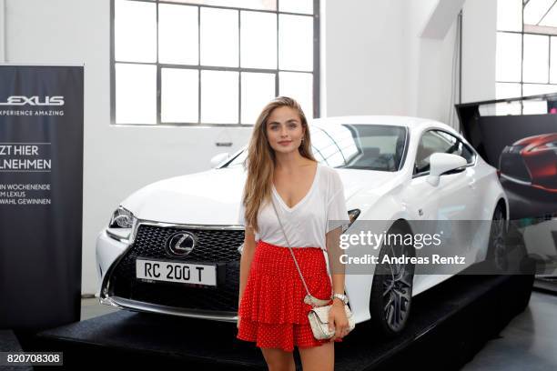 Sofia Tsakiridou poses in front of a Lexus at the 3D Fashion Presented By Lexus/Voxelworld show during Platform Fashion July 2017 at Areal Boehler on...