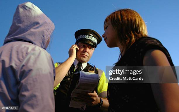 Paul Ferris makes a phonecall to the parents of two youths he has stopped after seeing them out and about after 9pm during his patrol of the streets...