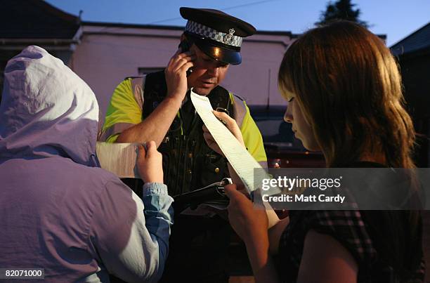 Paul Ferris makes a phone call to the parents of the two youths he has stopped and issued a warning to after seeing them out and about after 9pm...