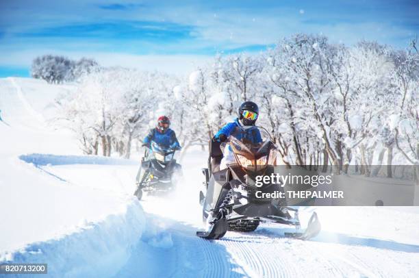 snowmobile fun - snow vehicle stock pictures, royalty-free photos & images