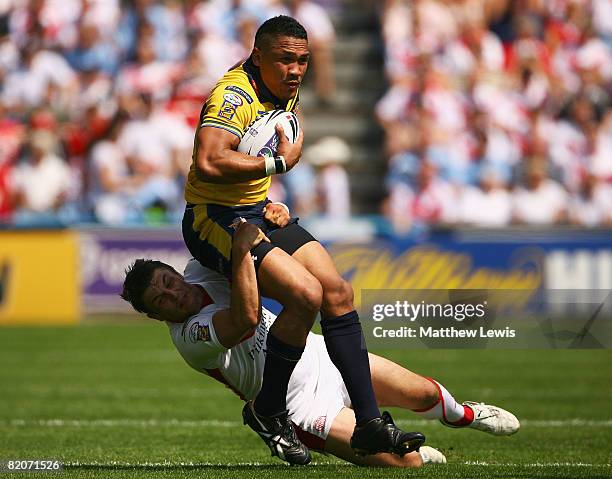 Clinton Toopi of Leeds is tackled by Jon Wilkin of St.Helens during the Carnegie Challenge Cup Semi Final match between Leeds Rhinos and St.Helens at...