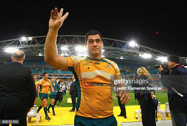 Wallabies captain George Smith waves to fans as he walks into the players tunnel after winning the 2008 Tri Nations series Bledisloe Cup match...