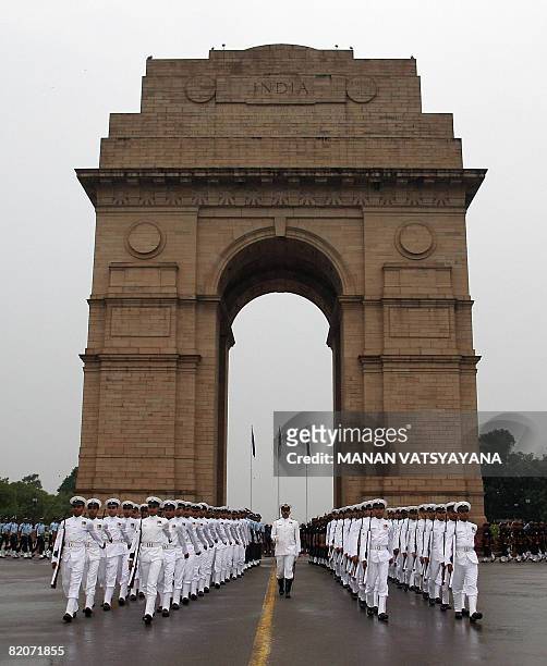 Indian soldiers leave after paying their respects to soldiers killed during the Kargil war at Amar Jawan Jyoti, India Gate in New Delhi on July 26,...