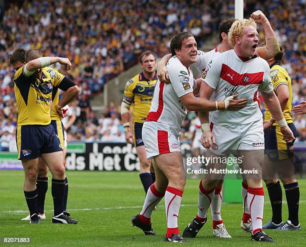 Bryn Hargreaves of St. Helens celebrates his try with team mate James Graham during the Carnegie Challenge Cup Semi Final match between Leeds Rhinos...