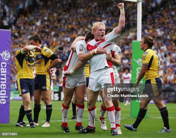 James Graham of St.Helens celebrates Bryn Hargreaves' try during the Carnegie Challenge Cup Semi Final match between Leeds Rhinos and St.Helens at...