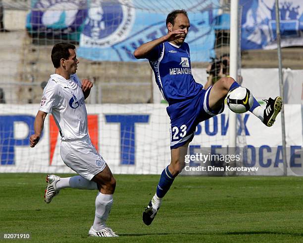 Jovan Tanasijevic of FC Dynamo Moscow competes for the ball with Konstantin Zyryanov of FC Zenit St Petersburg during the Russian Premier League...