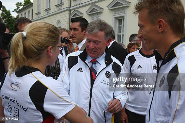 German President Horst Koehler chats with athletes of the German Olympic team at Schloss Bellevue Palace on July 26, 2008 in Berlin, Germany.