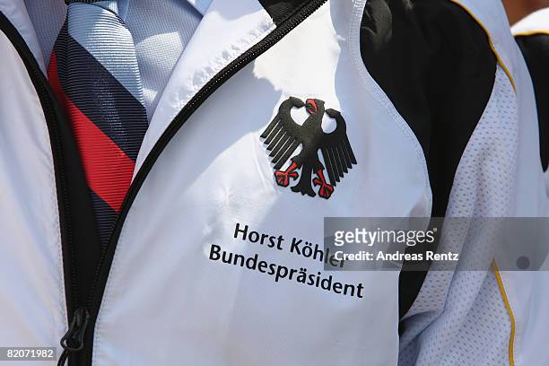 German President Horst Koehler is delighted to wear his new German Olympic jacket, he reiveved from the German Olympic Sports Association DOSB at...