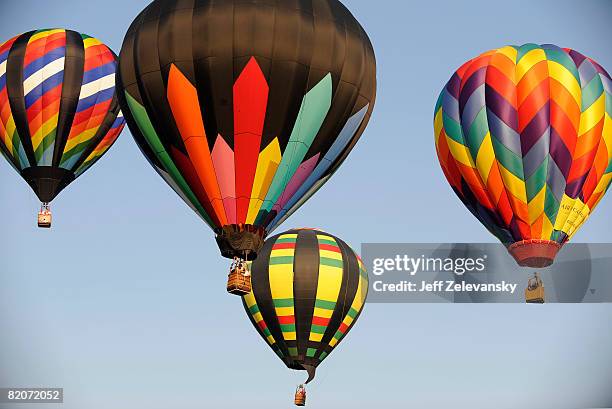 Hot air balloons rise into the sky at the 26th Annual Quick Chek New Jersey Festival of Ballooning at the Solberg Airport July 26, 2008 in...