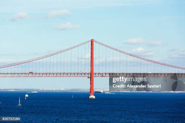 april 25th bridge in lisbon, portugal - bridge side view stock pictures, royalty-free photos & images