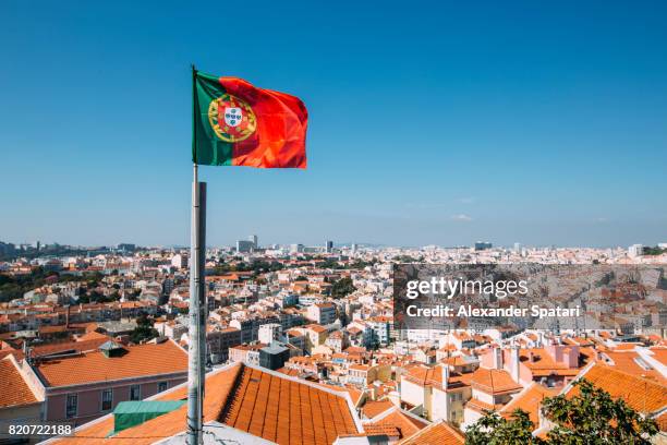 portuguese flag and lisbon skyline, portugal - portugal stock-fotos und bilder