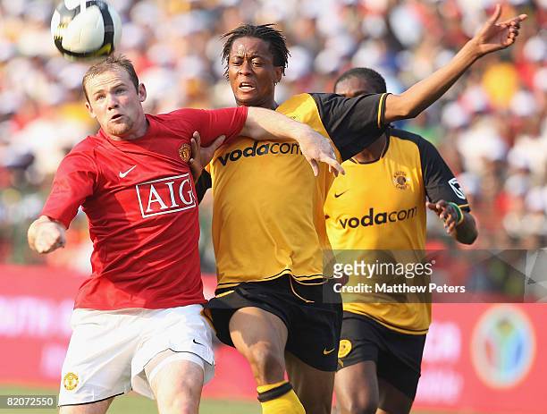 Wayne Rooney of Manchester United clashes with Renielwe Letsholonyane of Kaizer Chiefs during the Vodacom Challenge pre-season friendly match between...