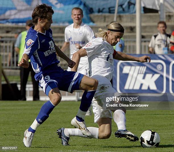 Dmitri Kombarov of FC Dynamo Moscow competes for the ball with Anatoliy Tymoschuk of FC Zenit St Petersburg during the Russian Premier League match...