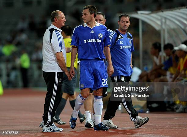 John Terry of Chelsea talks to coach Luiz Felipe Scolari after coming off during the Macau International Football challenge between Chelsea and...