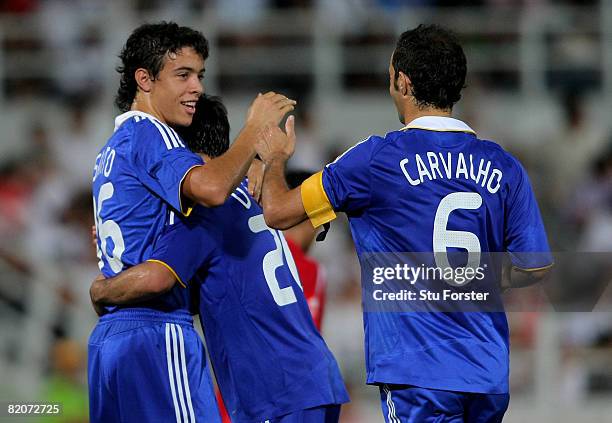 Chelsea striker Franco Di Santo is congratulated by Ricardo Carvalho during the Macau International Football challenge between Chelsea and Chengdu...