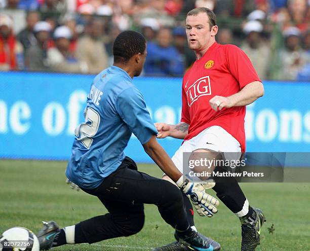 Wayne Rooney of Manchester United scores their second goal during the Vodacom Challenge pre-season friendly match between Kaizer Chiefs and...