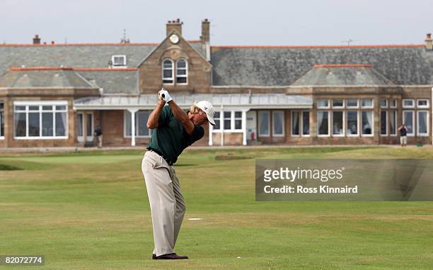 Greg Norman of Australia plays his second shot to the par four 18th hole during the third round of the Senior Open Championships at Royal Troon on...