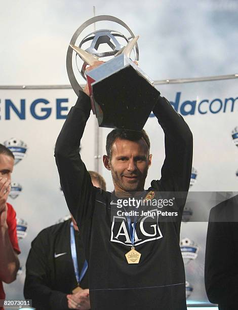 Ryan Giggs of Manchester United lifts the Vodacom Challenge trophy after the Vodacom Challenge pre-season friendly match between Kaizer Chiefs and...